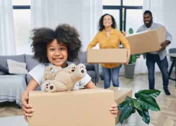 'Family moving out. People packing boxes indoors. Importance of helping each other