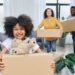 'Family moving out. People packing boxes indoors. Importance of helping each other